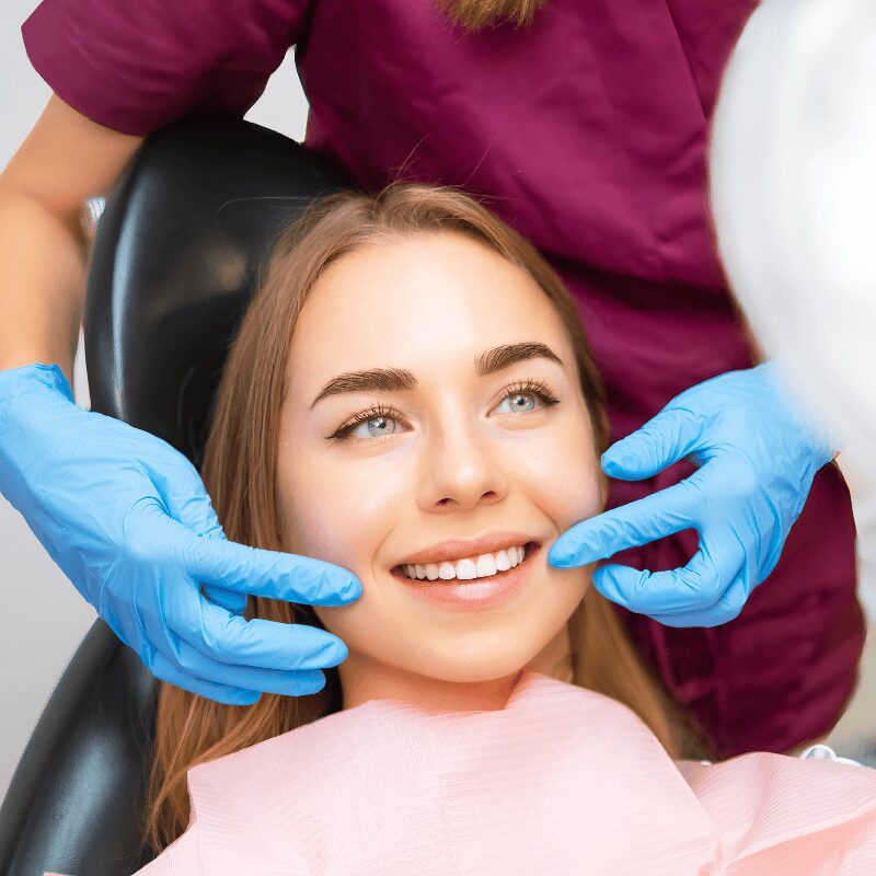 young woman smiling during veneer appointments